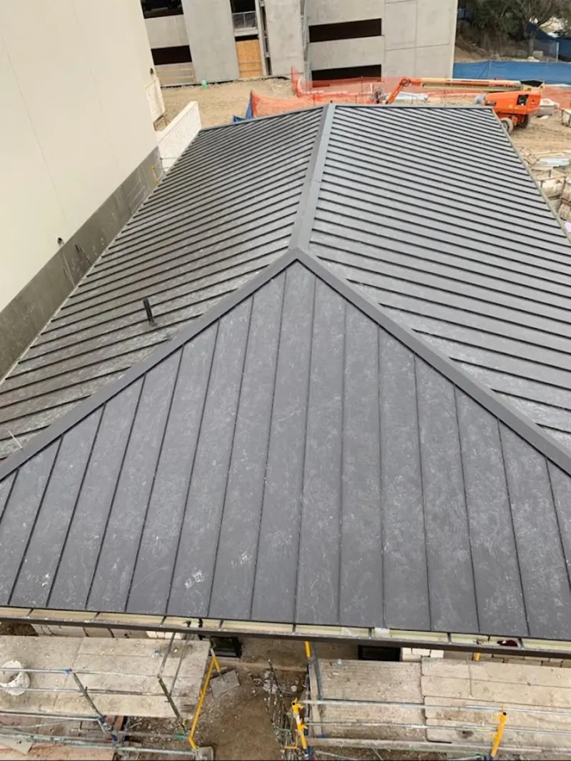 Commercial metal roof construction with crane equipment in Haddon Heights